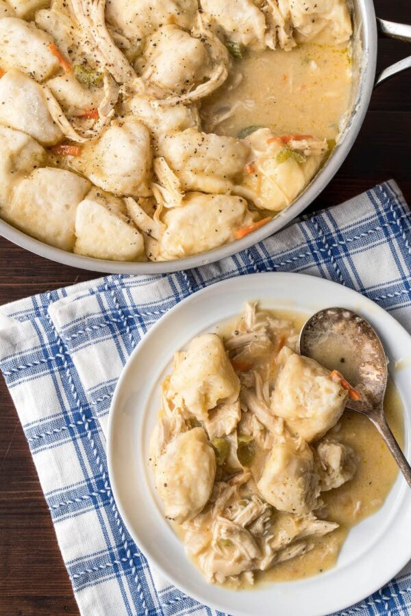 Soup in a skillet and on a plate with a spoon.