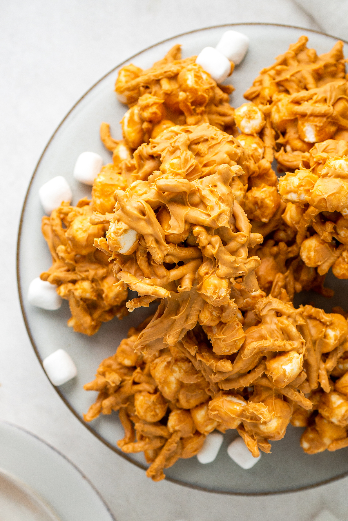 A serving platter with stacks of butterscotch haystacks.