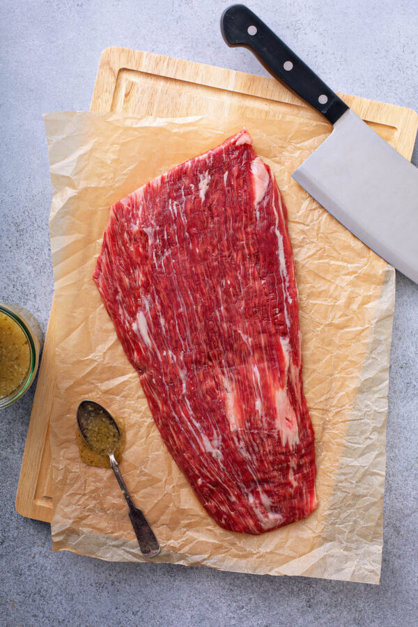 Flank Steak on parchment paper for Ropa Vieja.