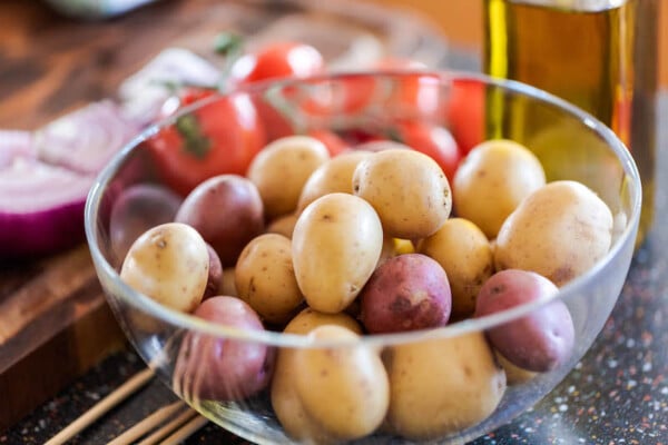 Red and white potatoes in a glass bowl.