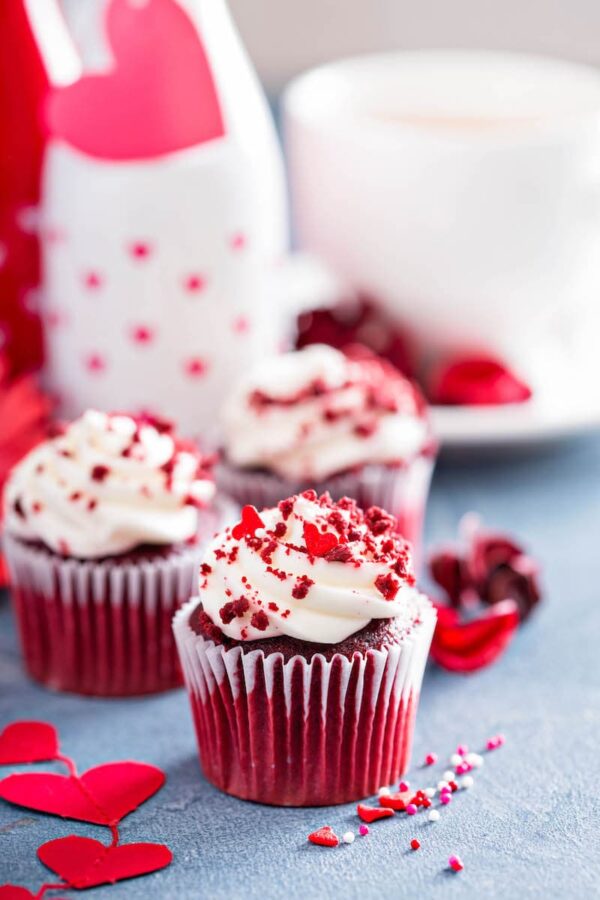 Photo of red velvet cupcakes with heart decorations