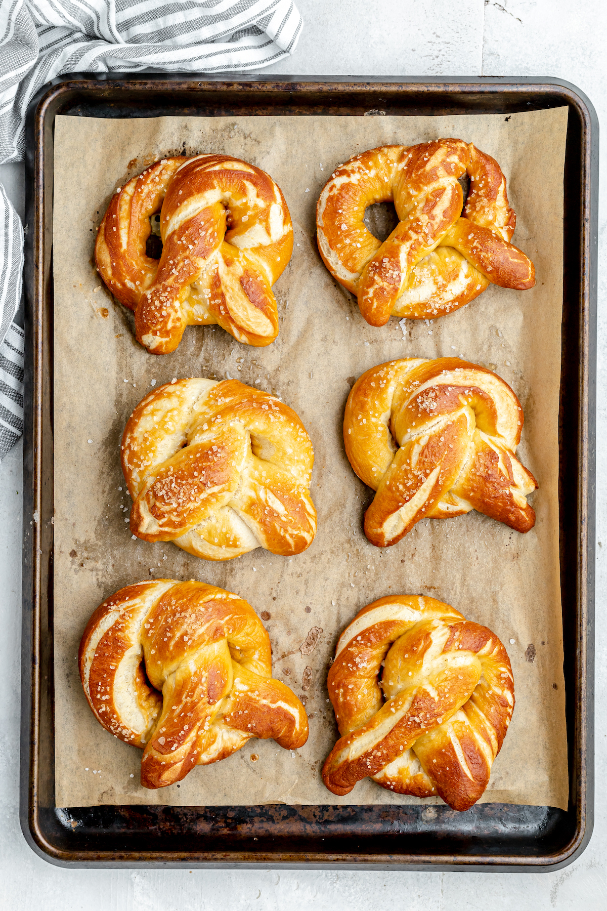 Six baked snacks on a baking sheet.