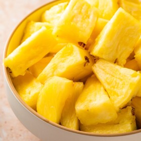 Chunks of fresh pineapple in a bowl.