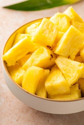 Chunks of fresh pineapple in a bowl.