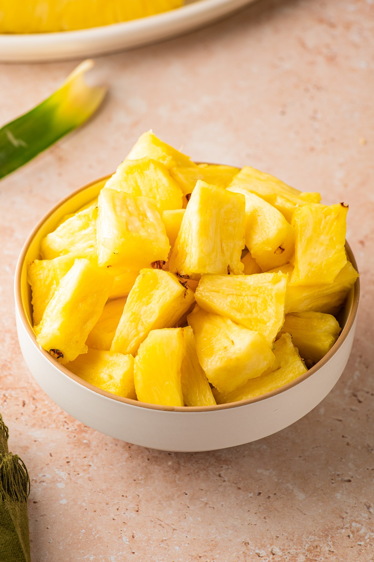 A bowl of fresh pineapple.