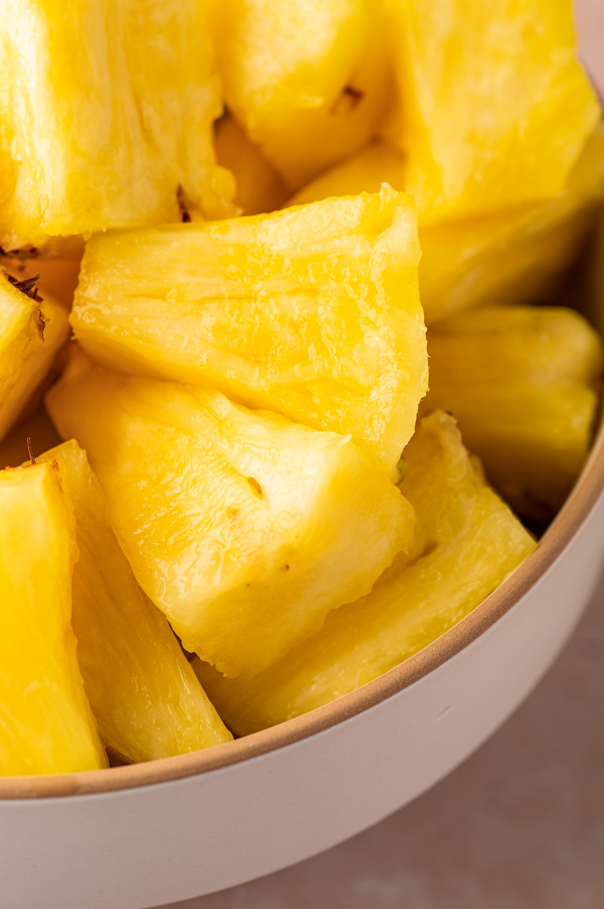 Close-up shot of fresh pineapple chunks.