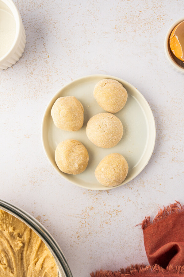 Balls of raw dough on a plate. 