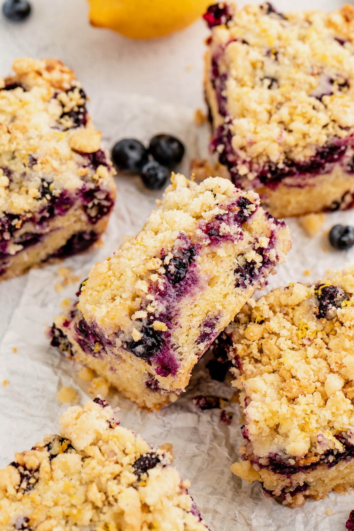 A lemon blueberry buckle square leaned on another one