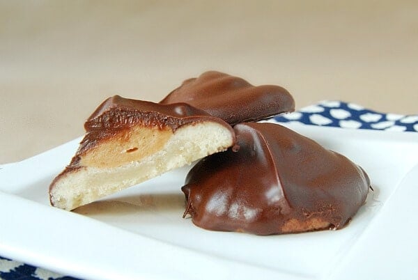 Three Homemade Chocolate and Peanut Butter Tagalongs Cookies on a White Plate