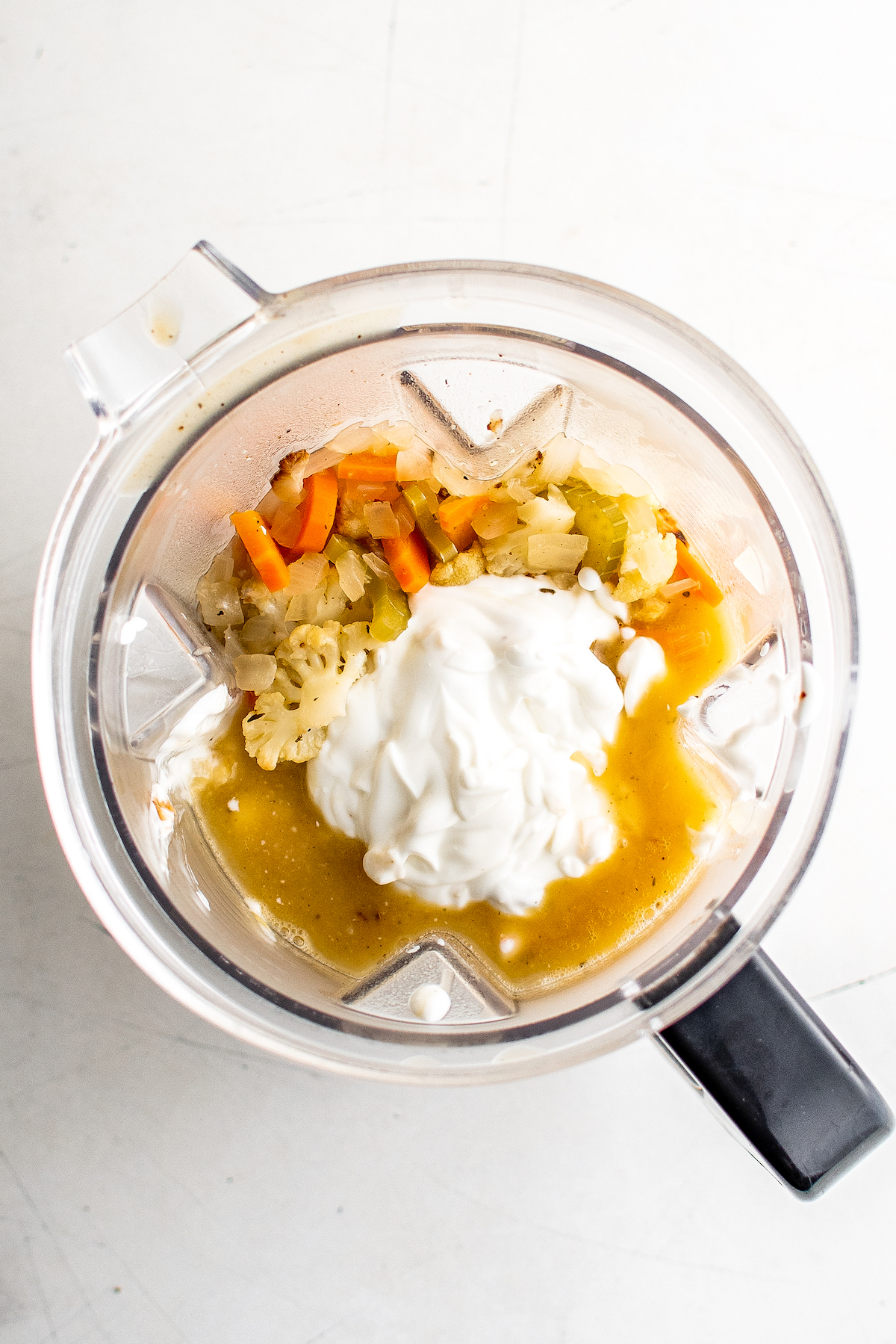 Veggie soup in a blender with Greek yogurt.