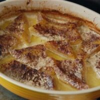 Baked Cushaw in a yellow casserole dish