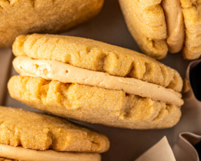 Homemade peanut butter sandwich cookies, viewed from the side.