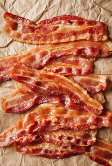 crispy bacon cooked in the oven on parchment paper