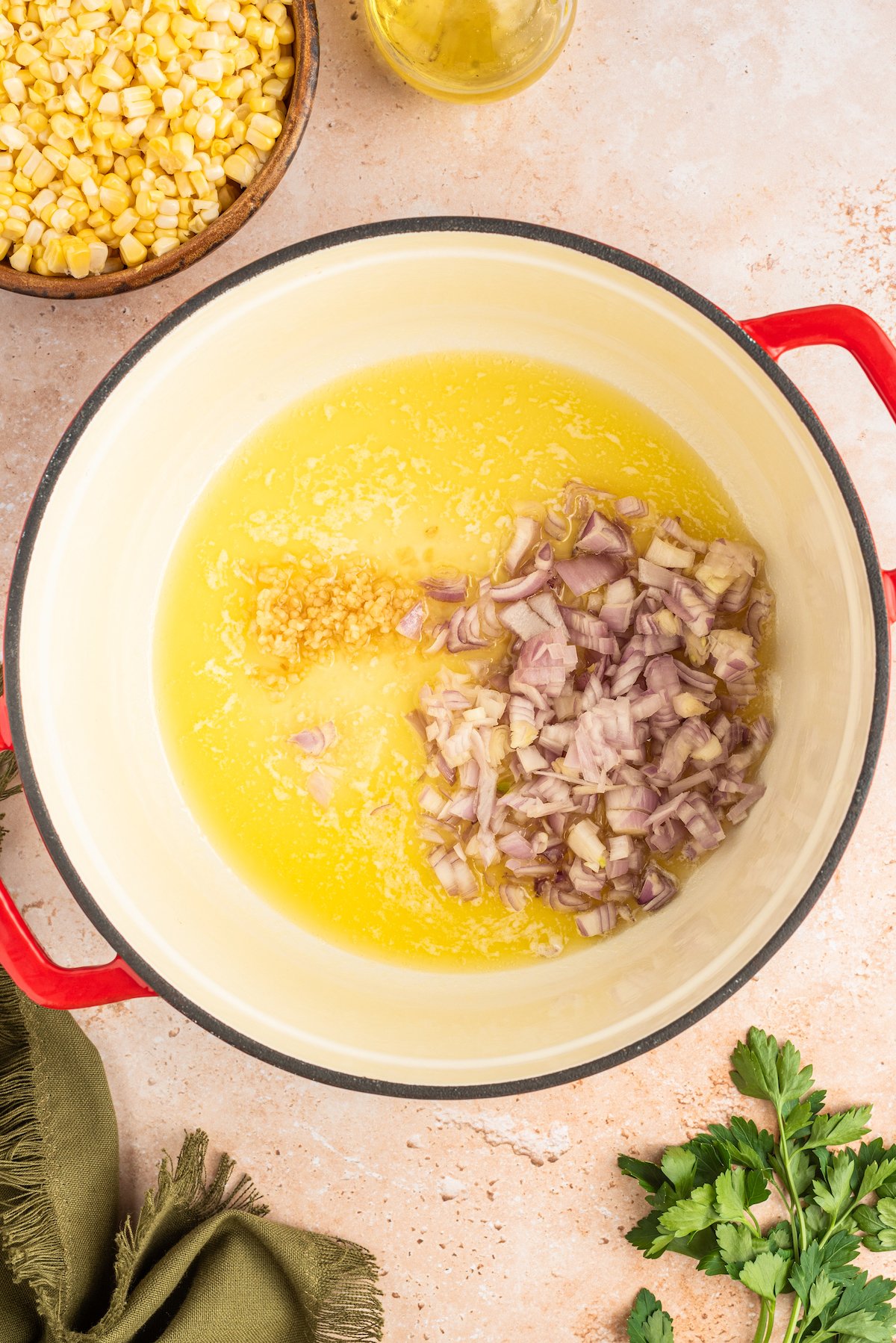 Cooking the garlic and shallots in the pot.