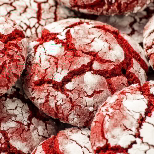 Red velvet crinkle cookies close-up, showing texture.