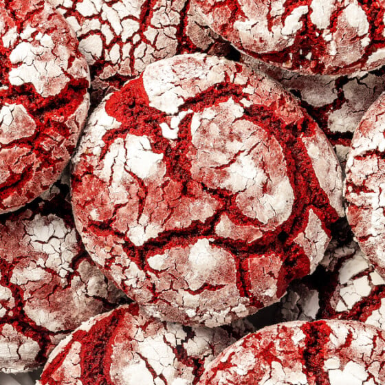Landscape shot of red velvet crinkle cookies on a plate.
