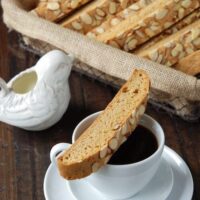 An Almond Biscotti Cookie Balanced on Top of a Coffee Mug