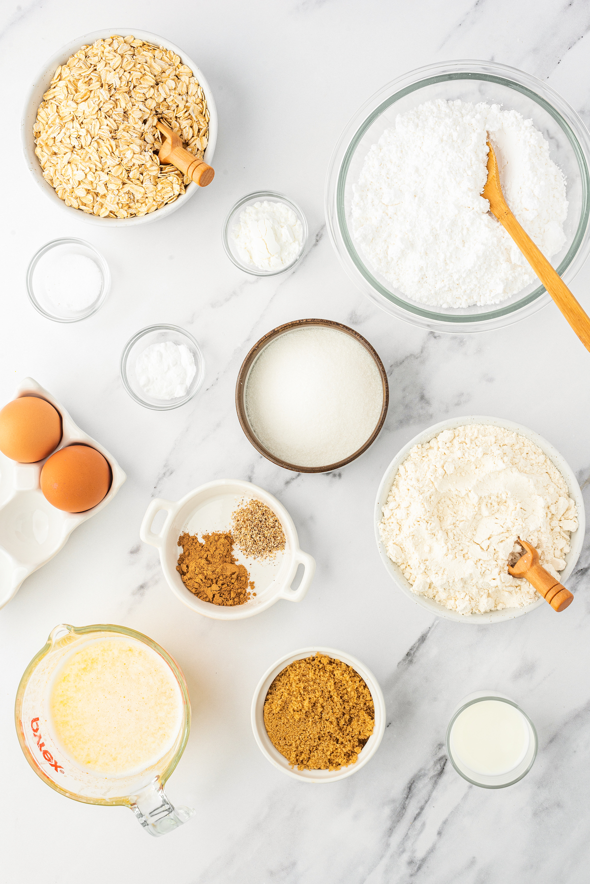 From top: Oats, powdered sugar, baking powder, baking soda, salt, eggs, sugar, flour, melted butter, brown sugar, milk.