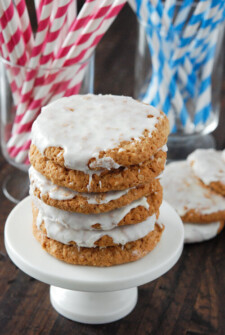 Stacks of Old Fashioned Iced Oatmeal Cookies on small white cake stand