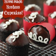 Homemade Hostess Cupcakes in red wrapper on a cooling wrack