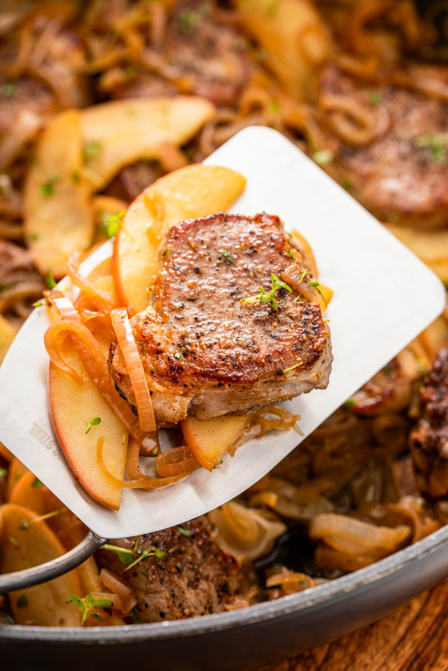 Slice of juicy pork tenderloin with apples. 