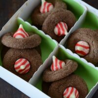 These candy cake cookies are filled with chocolate and topped with Hershey's candy cane kisses.