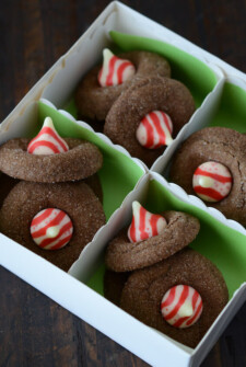 These candy cake cookies are filled with chocolate and topped with Hershey's candy cane kisses.