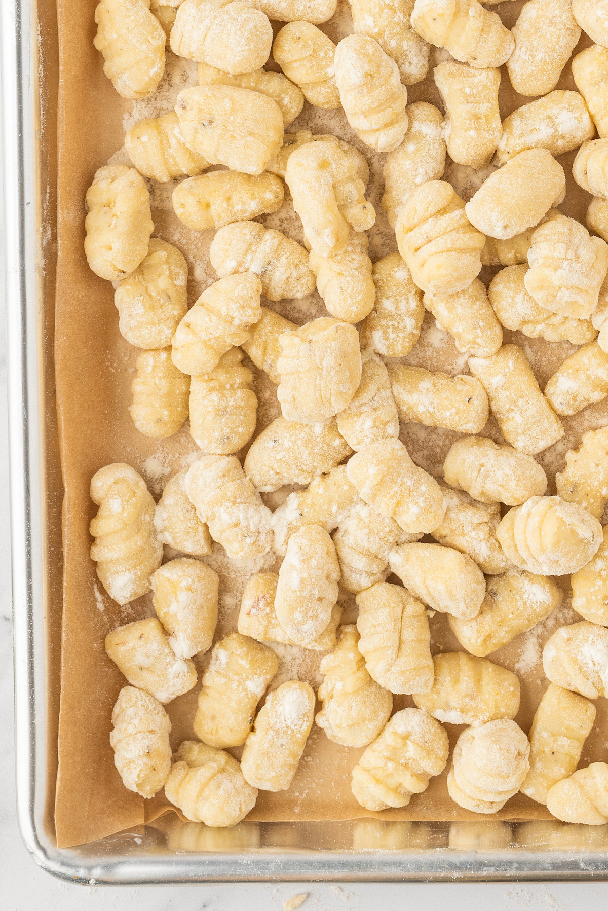 Potato dumplings on a baking tray.