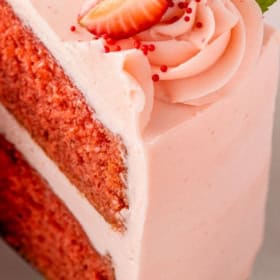 Strawberry dream cake is topped with sweet strawberry buttercream.