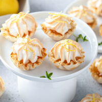 Four phyllo cup lemon pies with meringue topping.