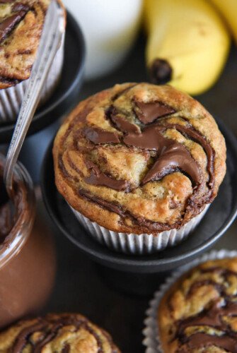 Nutella Banana Swirl Muffins: you just need one-bowl and 30 minutes to make these ultimate banana muffins! #Nutella #Banana #Muffins