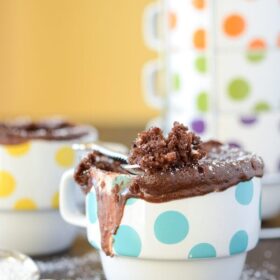 Chocolate Peanut Butter Mug Cake in a white and blue polka dotted mug