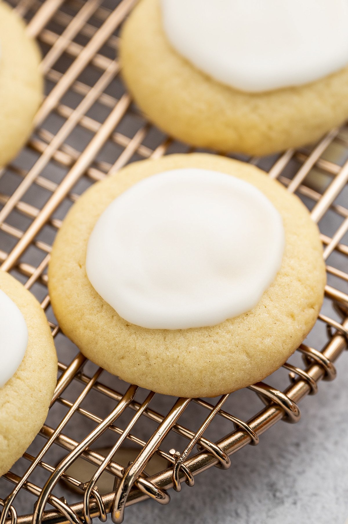 Almond meltaway cookies on a wire rack.