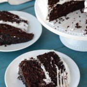 Dark chocolate marshmallow dream cake slices on plates.