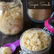 Three Glass Jars Filled with Homemade Sugar Scrub on a Table