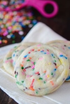 Soft Sprinkle Sugar Cookies with scattered sprinkles.