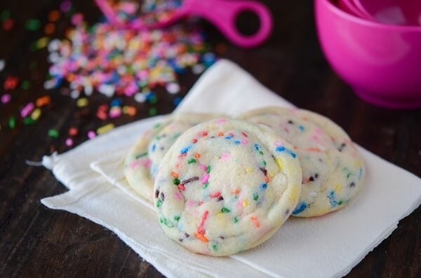 Soft Sprinkle Sugar Cookies with scattered sprinkles.
