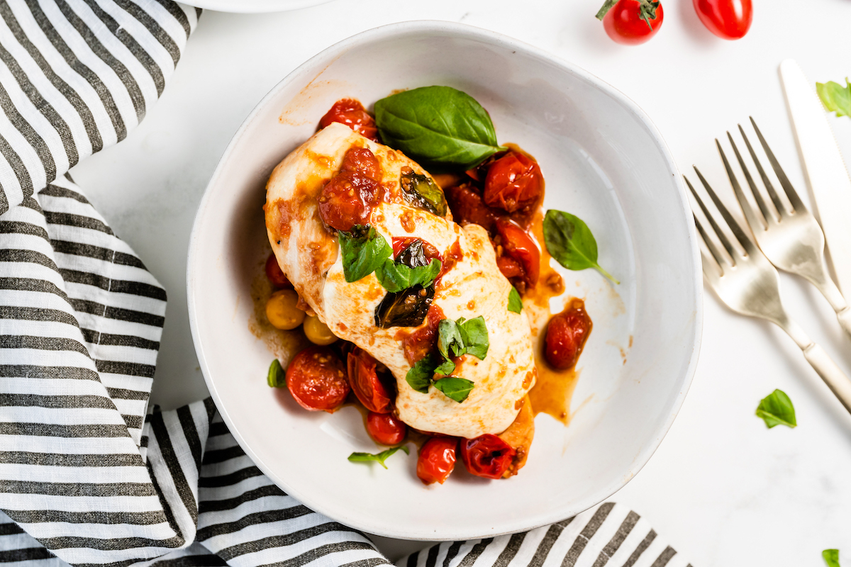 Chicken breast with basil, mozzarella cheese, and tomatoes.