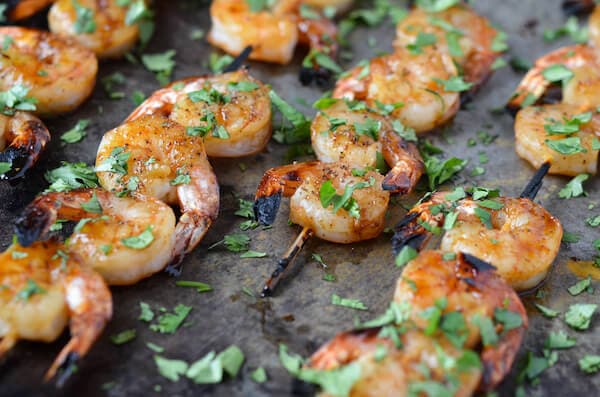 Sheet pan of Sweet & Sticky Shrimp skewers