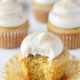 A bite taken out of a Pumpkin Dream Cupcake