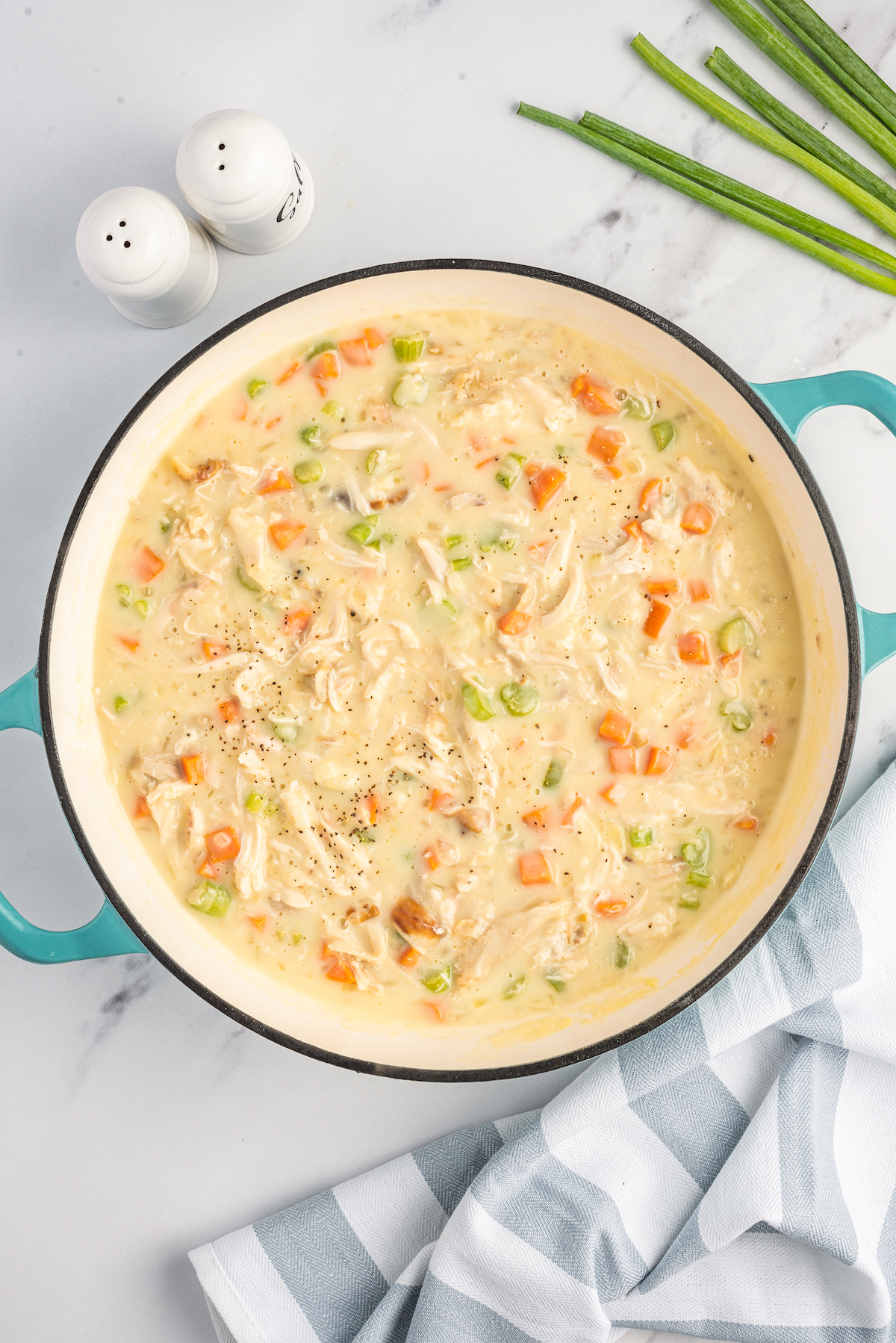 A pot of creamy chicken and vegetables.