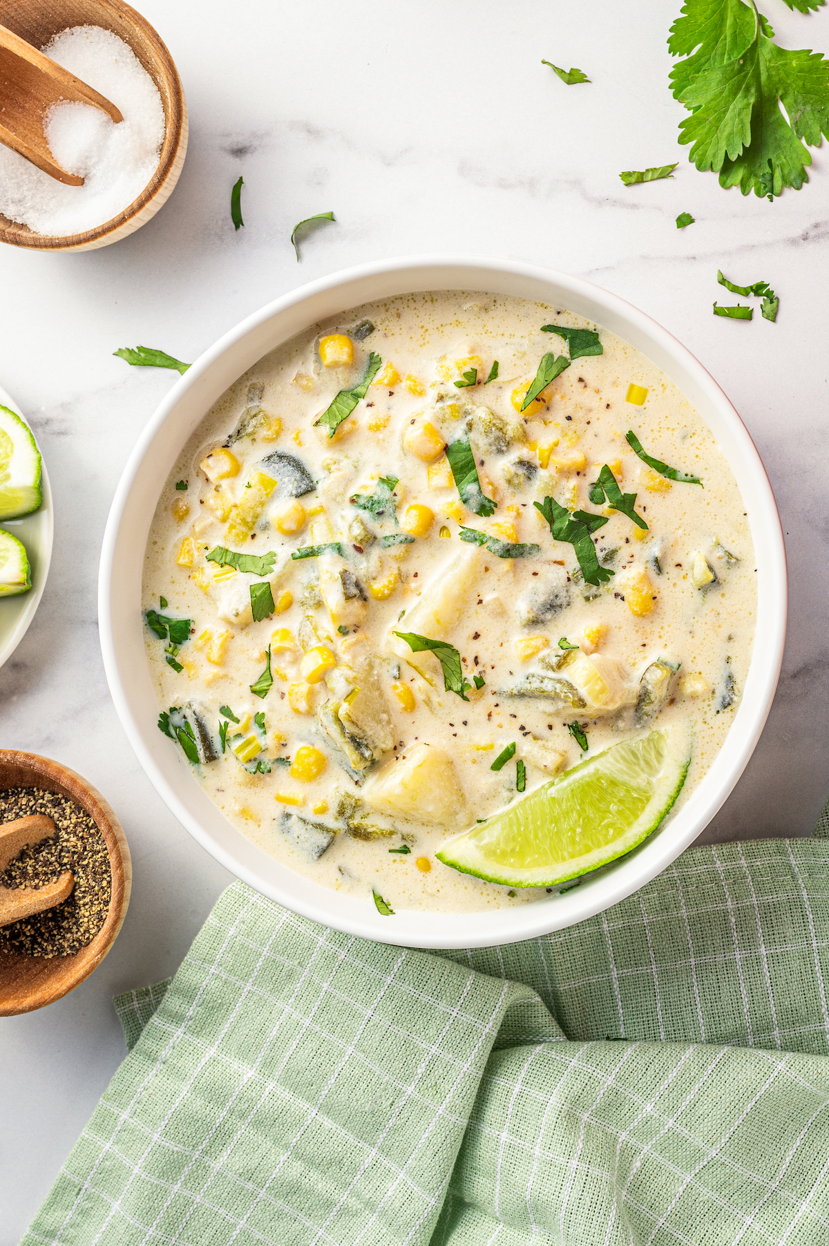 Creamy poblano corn soup with cilantro in a bowl. 