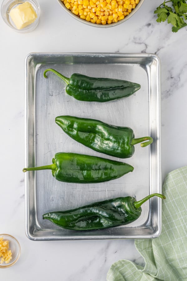 Poblanos on the baking sheet. 