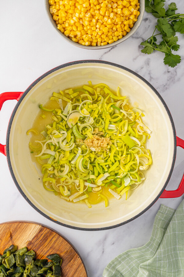 Adding the leeks and garlic to the pot. 