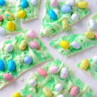 Nine Pieces of Easter Egg Bark Candy on a White Surface