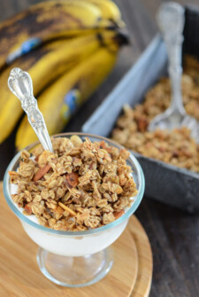 Banana Nut Granola served over yogurt in a glass dish with a spoon