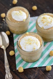 No Bake Mini Peanut Butter Cheesecakes with a spoon on green and white stripped napkins