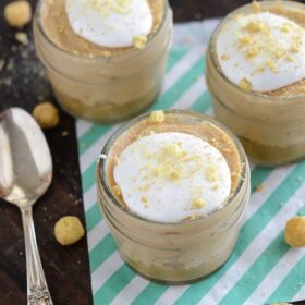 No Bake Mini Peanut Butter Cheesecakes with a spoon on green and white stripped napkins