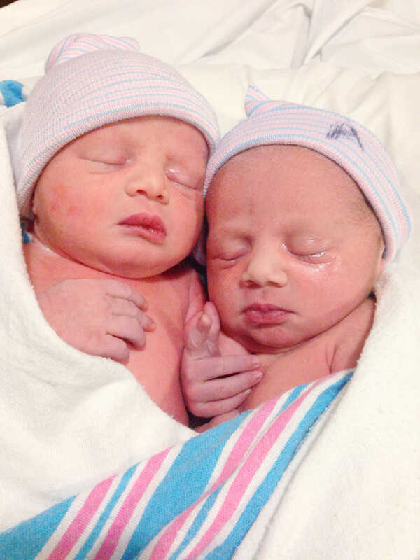 Newborn Twins Swaddled Together and Sleeping Right After their Birth