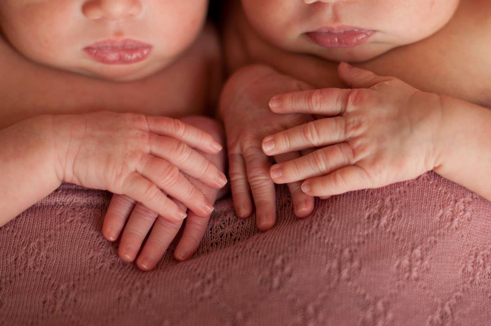A Close-Up Shot of the Twins' Tiny Hands